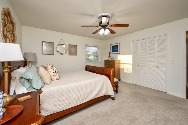 bedroom featuring a closet, carpet flooring, a ceiling fan, and baseboards