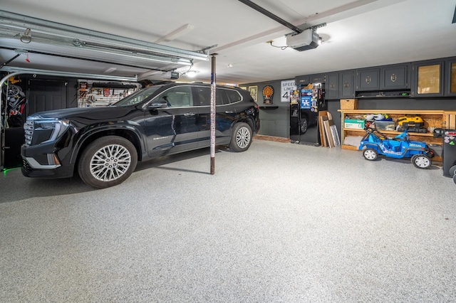 garage featuring a garage door opener