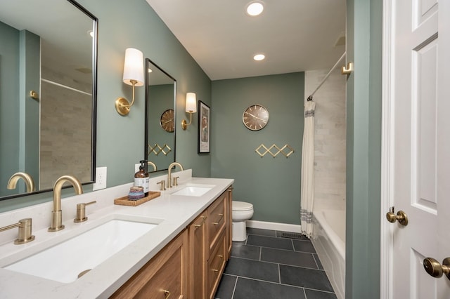 bathroom with tile patterned flooring, a sink, toilet, and baseboards