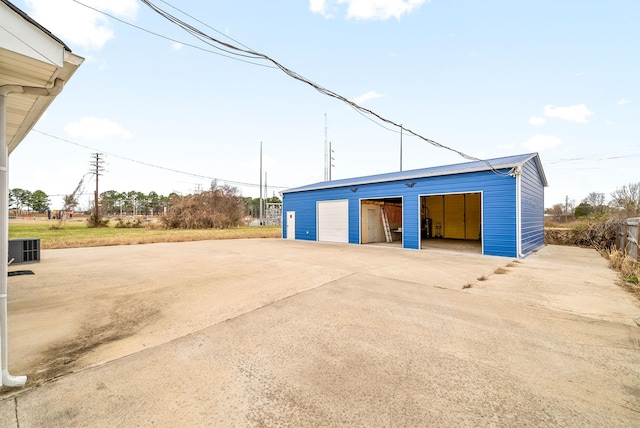 detached garage featuring central air condition unit