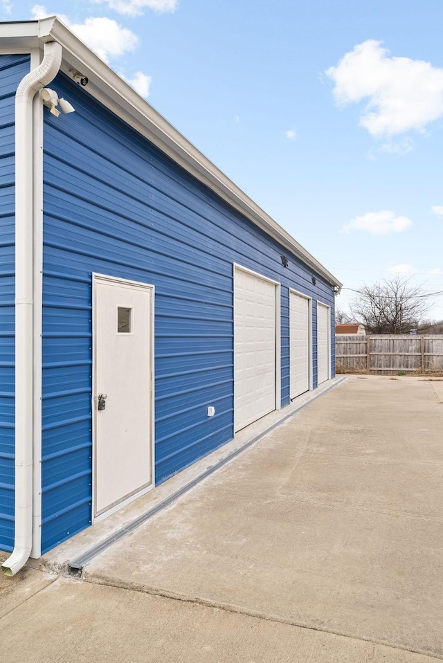 garage featuring fence