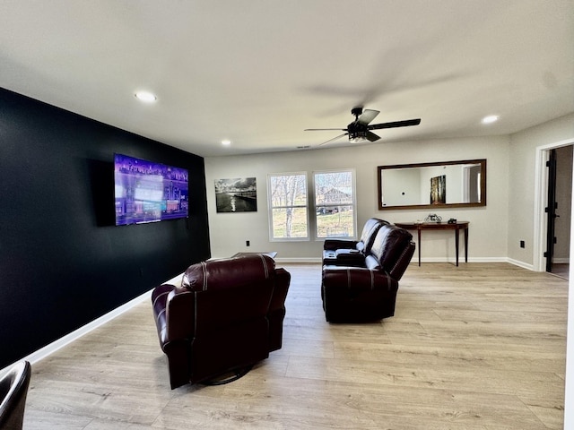 living room with a ceiling fan, recessed lighting, light wood-style flooring, and baseboards