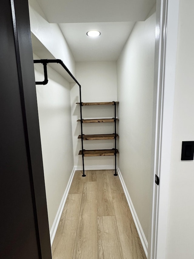 walk in closet featuring light wood-type flooring