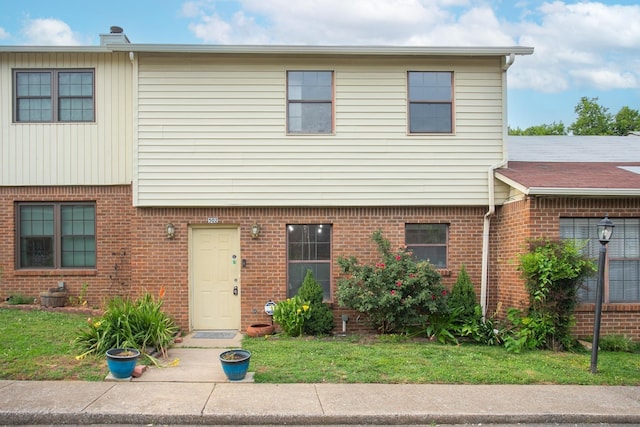 view of front of home featuring brick siding