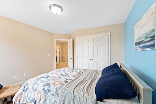 bedroom with a closet and visible vents