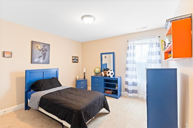 bedroom featuring carpet floors, visible vents, and baseboards