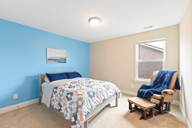 bedroom with carpet floors, baseboards, and visible vents