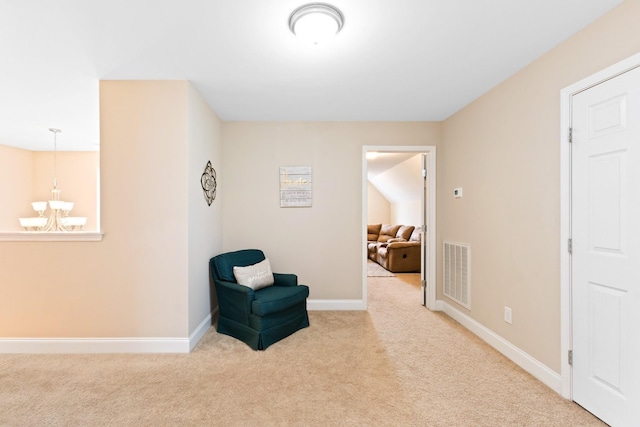 living area featuring a chandelier, carpet, visible vents, and baseboards