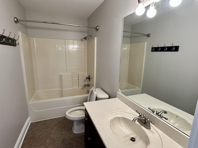 full bath featuring shower / tub combination, toilet, vanity, baseboards, and tile patterned floors