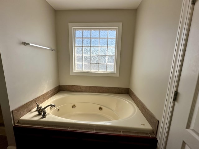 full bath with a whirlpool tub