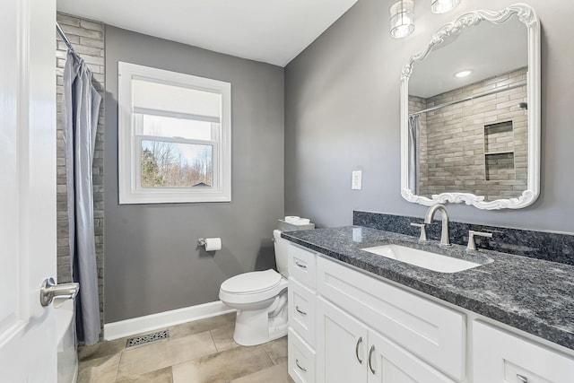 full bathroom with visible vents, toilet, vanity, baseboards, and tile patterned floors