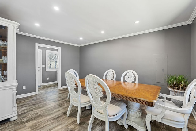 dining area with recessed lighting, crown molding, baseboards, and wood finished floors