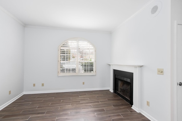 unfurnished living room with ornamental molding, a fireplace, and dark wood finished floors