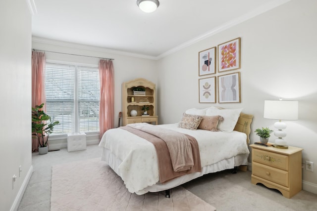 carpeted bedroom featuring ornamental molding and baseboards