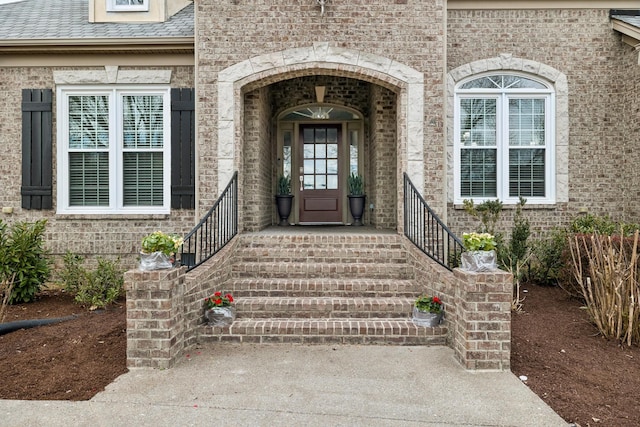 entrance to property with brick siding