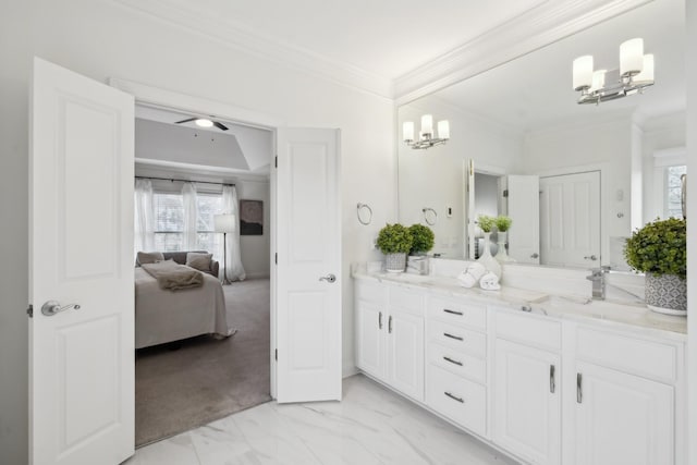 ensuite bathroom with marble finish floor, a notable chandelier, crown molding, double vanity, and connected bathroom