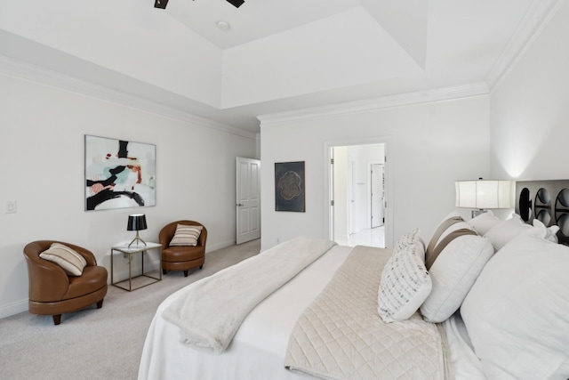 bedroom with carpet floors, baseboards, a tray ceiling, and ornamental molding