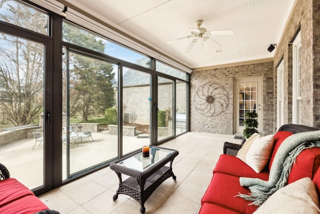 sunroom featuring plenty of natural light and ceiling fan