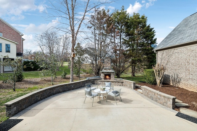 view of patio / terrace with an outdoor stone fireplace