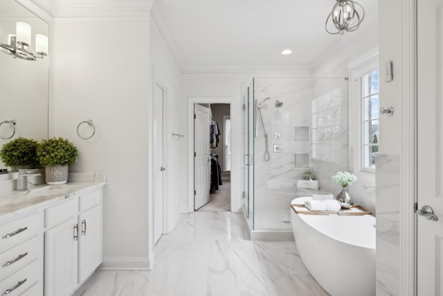 full bath featuring marble finish floor, crown molding, a freestanding bath, a shower stall, and vanity