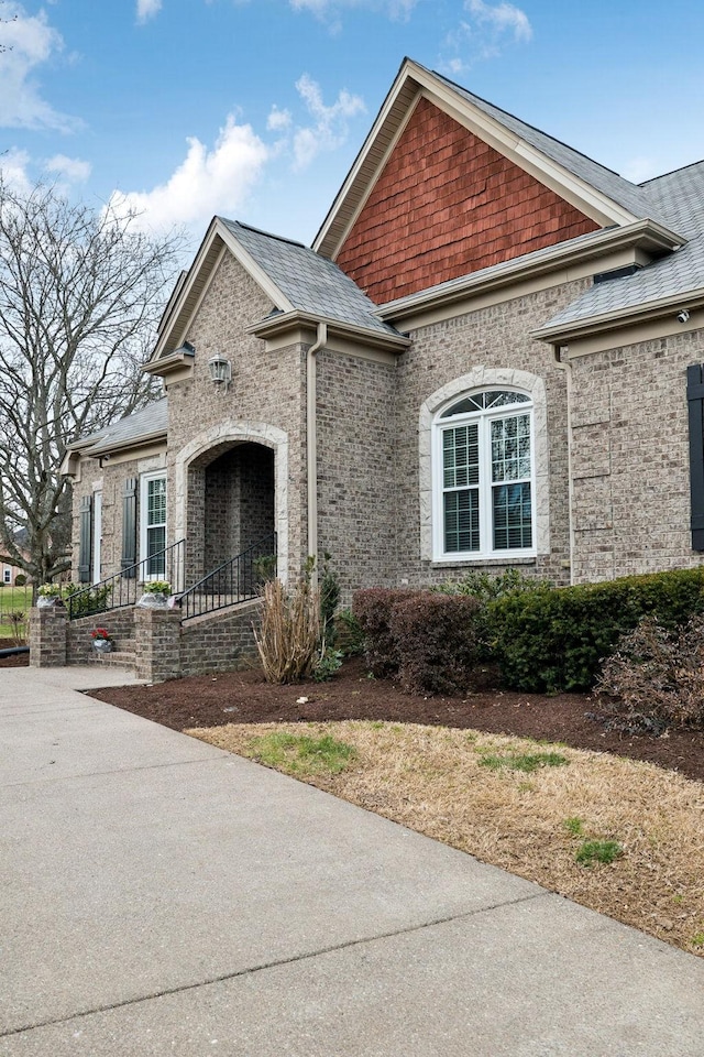 view of front of home featuring brick siding