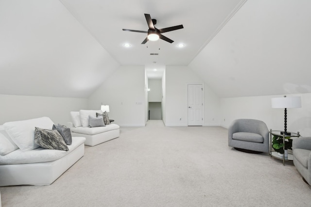 living area featuring lofted ceiling, baseboards, a ceiling fan, and carpet flooring