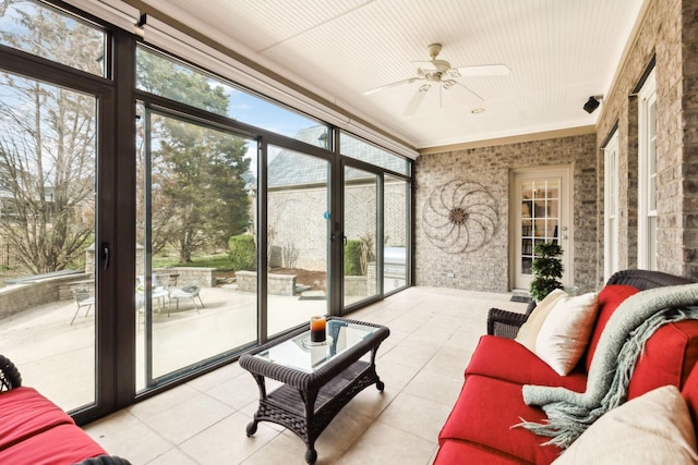 sunroom with a ceiling fan and a healthy amount of sunlight