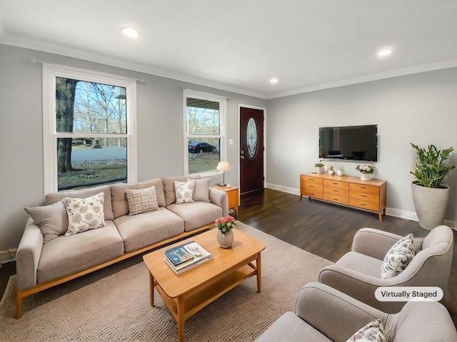 living area with baseboards, recessed lighting, dark wood finished floors, and crown molding