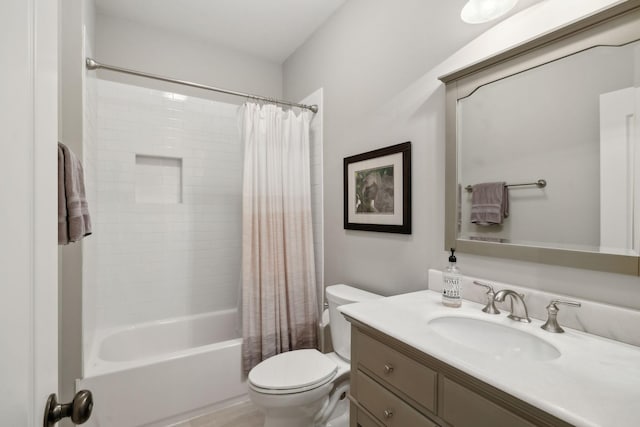 bathroom with toilet, shower / bath combo, and vanity