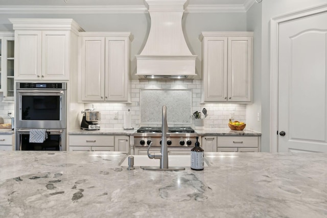 kitchen featuring stainless steel appliances, ornamental molding, backsplash, and custom exhaust hood