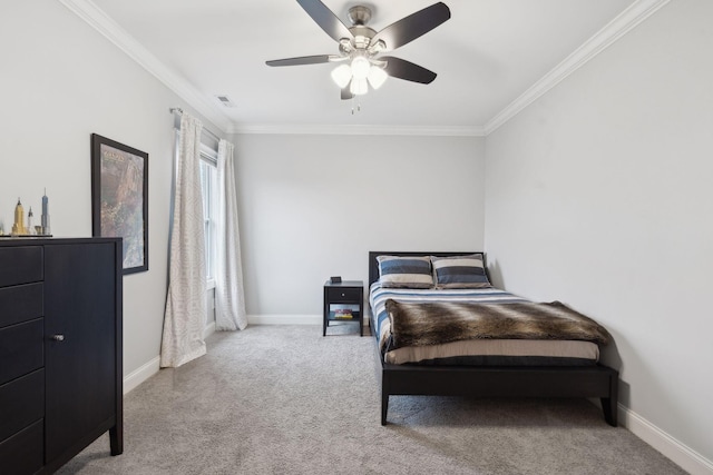 carpeted bedroom with ceiling fan, ornamental molding, visible vents, and baseboards