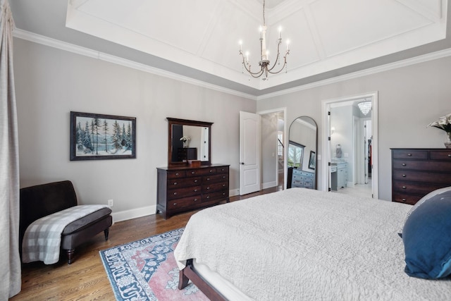 bedroom with a chandelier, coffered ceiling, wood finished floors, baseboards, and ornamental molding