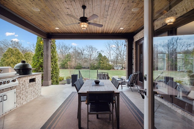 view of patio / terrace featuring ceiling fan, outdoor lounge area, an outdoor kitchen, and area for grilling