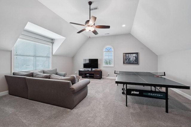 rec room featuring carpet floors, visible vents, vaulted ceiling, and baseboards