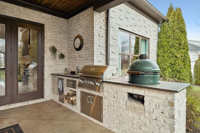 view of patio / terrace with exterior kitchen and area for grilling