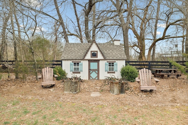 view of shed with fence