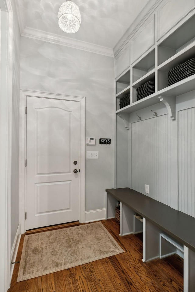 mudroom featuring ornamental molding, wood finished floors, and baseboards