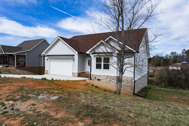 view of front of home with concrete driveway, an attached garage, and crawl space