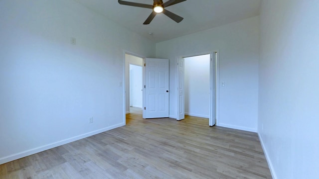 unfurnished bedroom with ceiling fan, baseboards, and wood finished floors