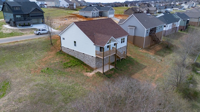 birds eye view of property with a residential view