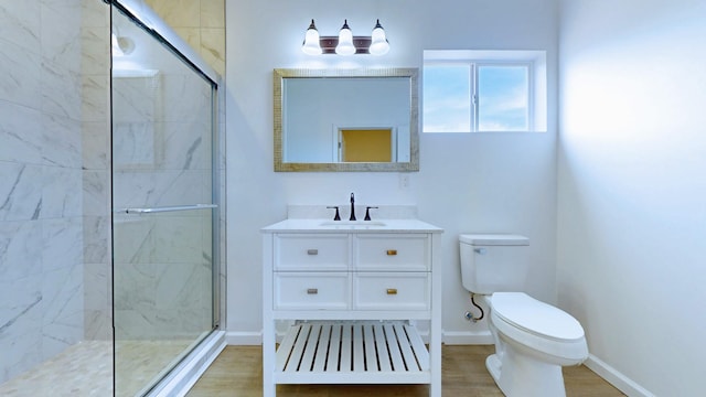 full bathroom with a shower with door, toilet, baseboards, and wood finished floors