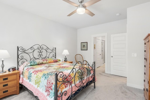 bedroom featuring a ceiling fan, carpet, and baseboards