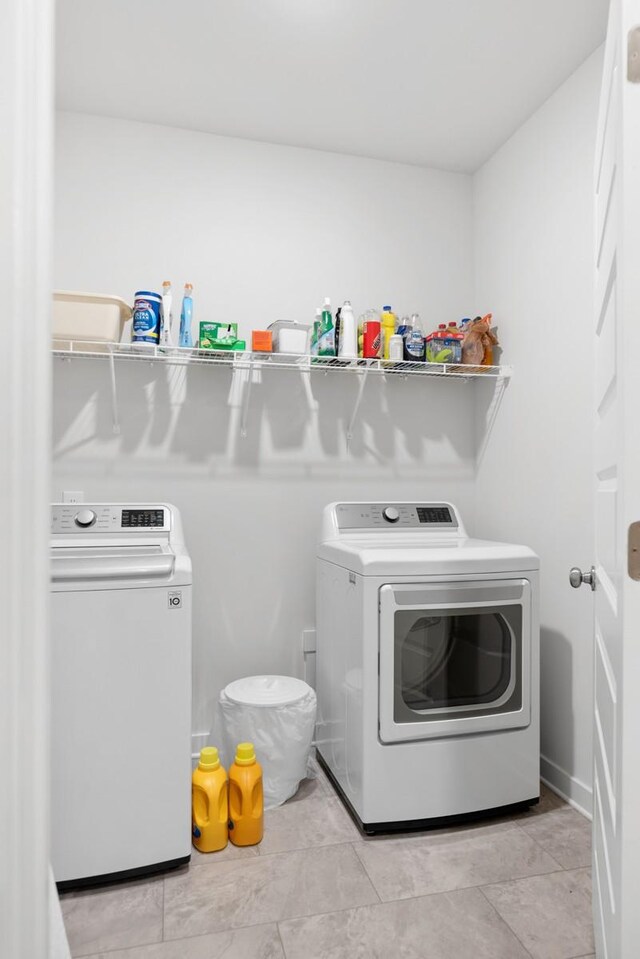 laundry area with laundry area and separate washer and dryer