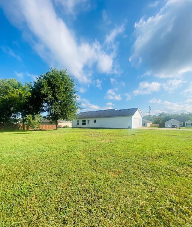 view of yard featuring a garage