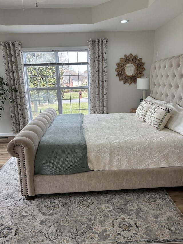 bedroom featuring wood finished floors