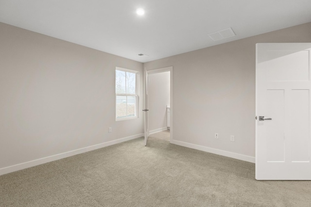 unfurnished bedroom featuring visible vents, baseboards, and carpet flooring