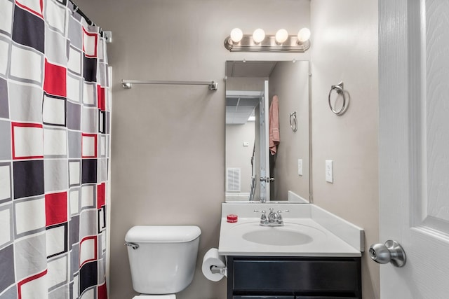 bathroom featuring a shower with curtain, vanity, and toilet