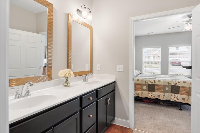 full bath featuring ceiling fan, double vanity, ensuite bath, and a sink