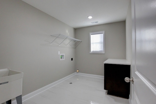 washroom with laundry area, visible vents, hookup for a washing machine, and baseboards