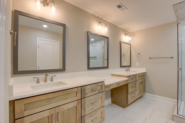 bathroom featuring visible vents, a shower, vanity, and baseboards